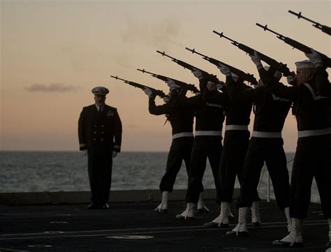 Soldiers giving a 21-gun salute