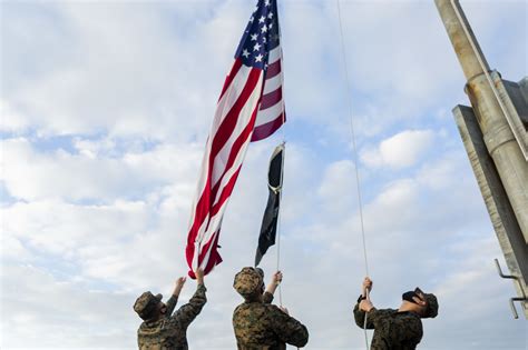 Soldiers Raising American Flag