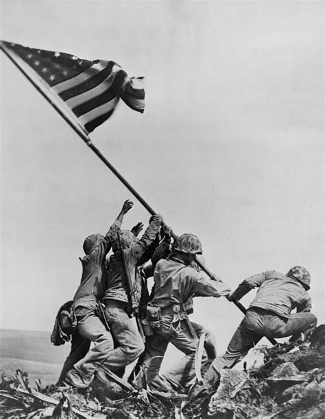 Soldiers raising the flag