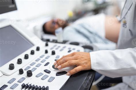 Sonographer operating ultrasound equipment