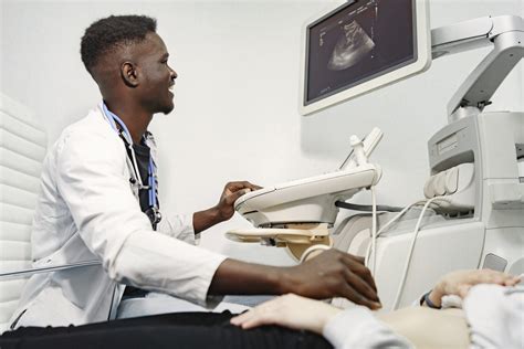 Sonographer working in a hospital environment