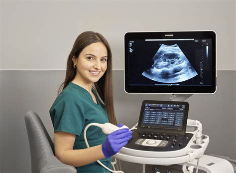 Sonographer working in a busy hospital environment