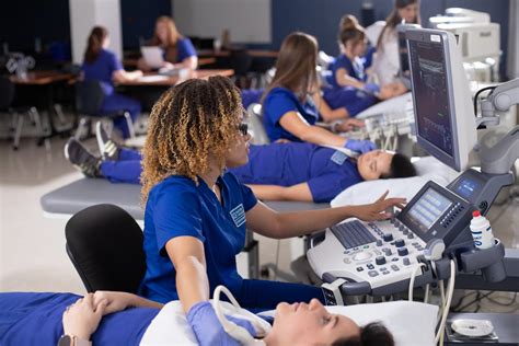 Sonographer student learning ultrasound techniques