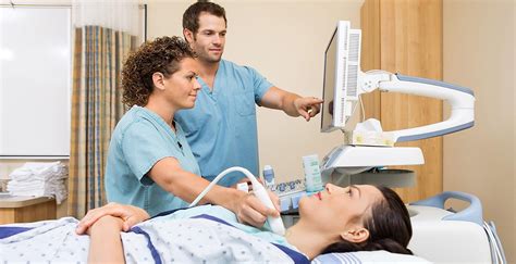 Sonographer interacting with patient