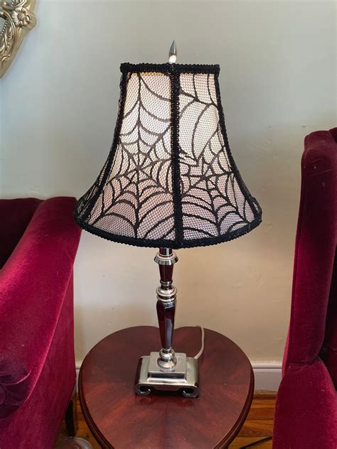 Spiderwebs on lamp meme