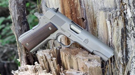 Springfield Mil Spec 1911 pistol on a wooden table