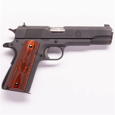 Springfield Mil Spec 1911 pistol with a tactical light attachment