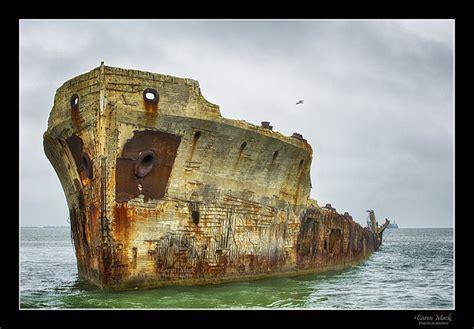 A photographer explores the SS Selma's hull