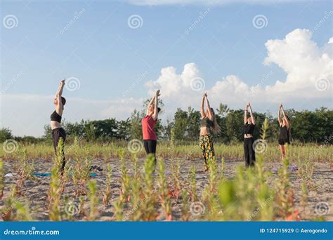 Practicing Sun Salutations outdoors for added invigoration