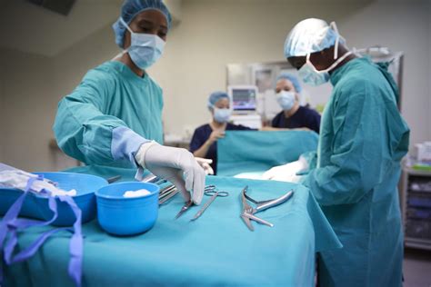 Surgical Technologist assisting surgeon