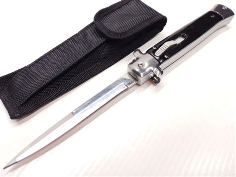 A switchblade knife with a silver blade and black handle