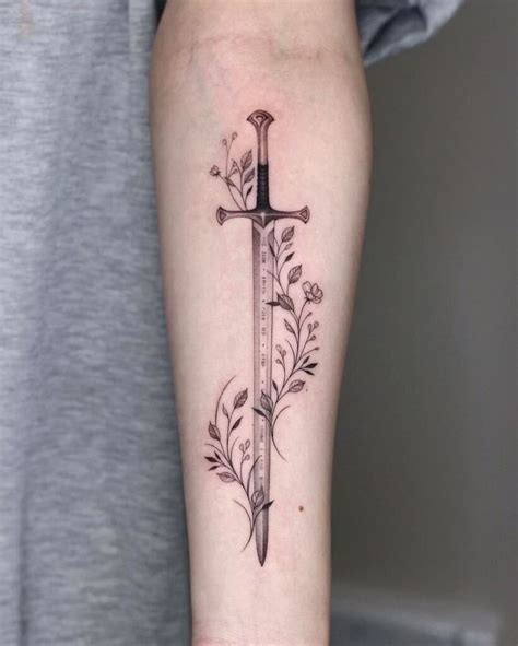 Sword tattoo with glowing blade design