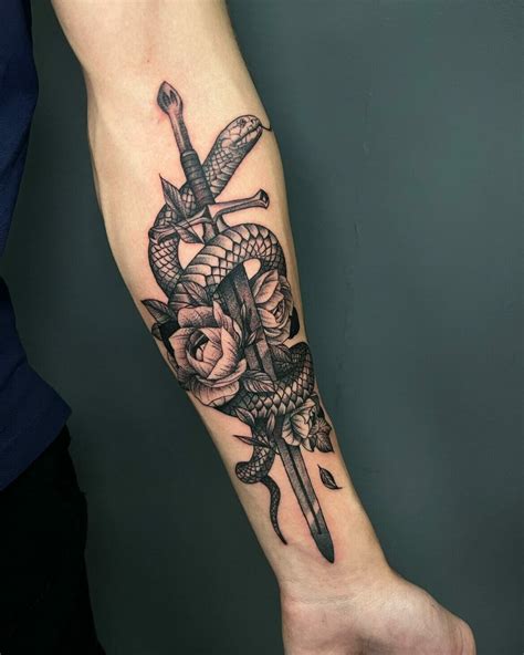 Sword tattoo with snake design