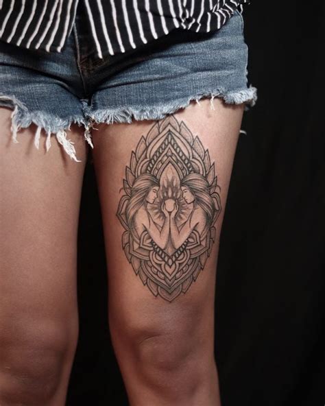 Symbolic thigh tattoos