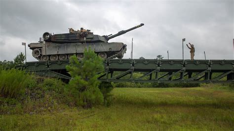 A tank on a bridge, highlighting its ability to operate in a variety of terrain