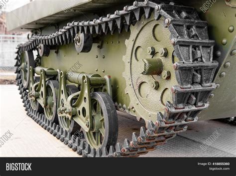 A detailed drawing of a tank's tracks and road wheels, showcasing the complex interplay of rubber and metal