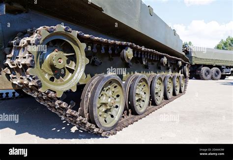 A detailed drawing of a tank's tracks and road wheels, showcasing the complex interplay of rubber and metal