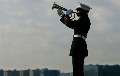 Soldiers standing at attention during Taps