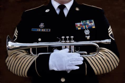 A bugler playing Taps at a memorial service