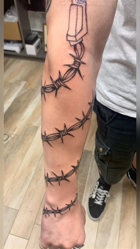 Description of Tattoos of Barbed Wire on Arm