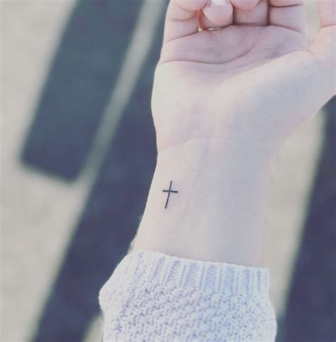 Tattoos of crosses on wrist