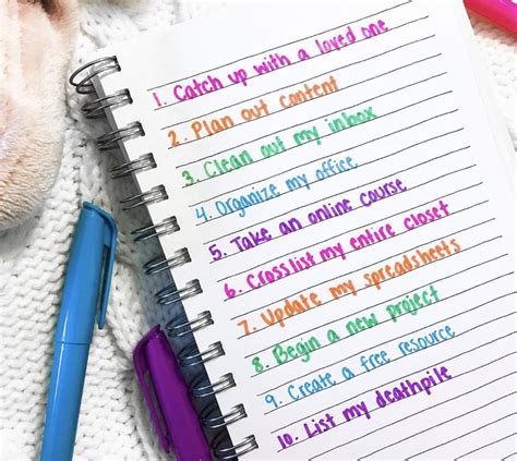 Image of a person holding a to-do list with a pen