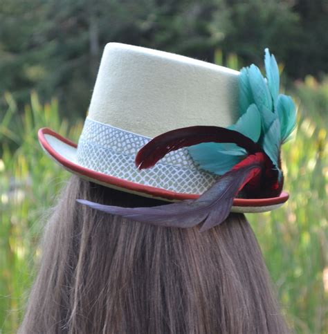 Top hat with band and feather