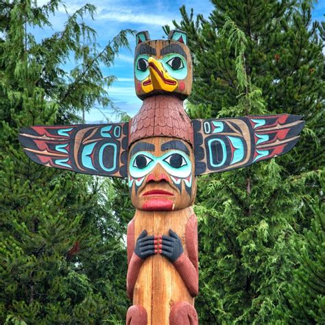 A collection of totem pole art featuring various animals and spirits