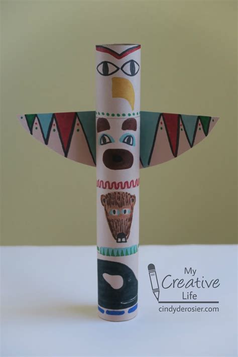 A collection of totem pole crafts featuring various animals and spirits