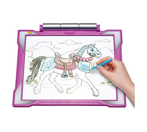 A child expressing their creativity on a light up tracing pad