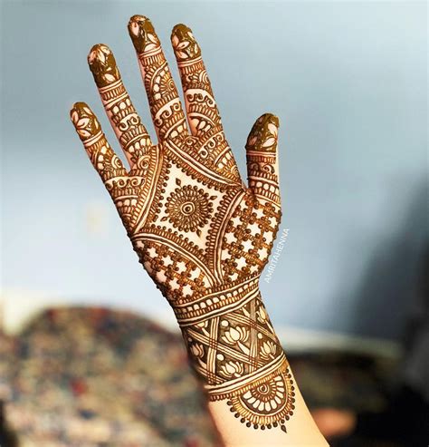 Traditional henna hand design with geometric patterns