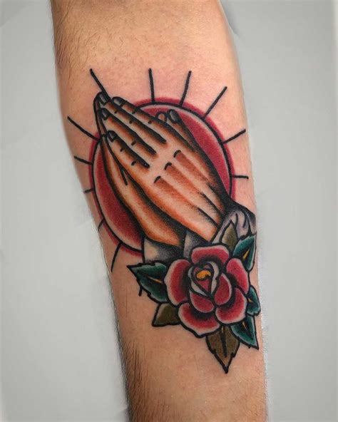 Traditional praying hands tattoo design