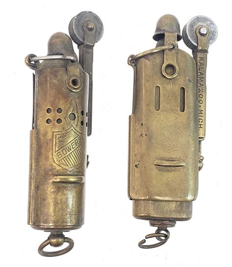 A close-up of a trench lighter's ignition system