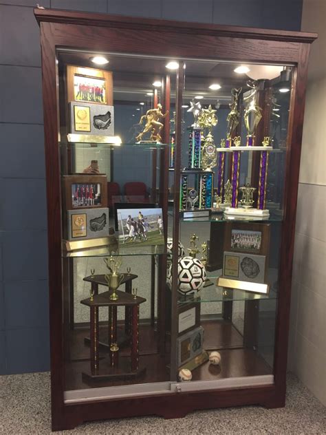 Trophy case with glass shelves