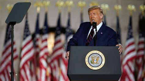 Donald Trump speaking at a podium