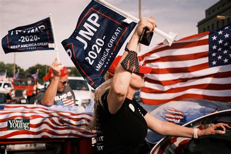 A Trump supporter waving an American flag