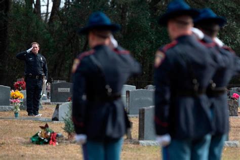 Trumpet player at gravesite