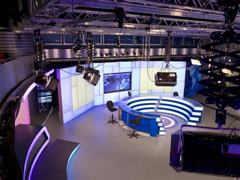 Meteorologists working in a TV studio