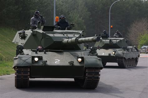 Ukrainian soldiers inspecting the newly arrived Challenger 2 tanks