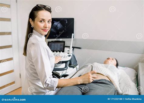 Ultrasound Technician Examining Patient