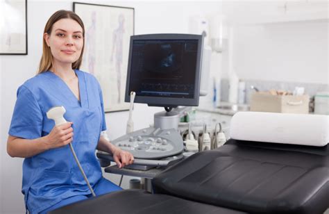 Ultrasound Technician Working with Patient