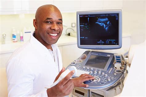 Ultrasound technologist preparing a patient for a procedure