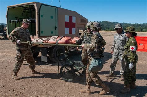 A US Army Field Medic treating a wounded soldier in the field