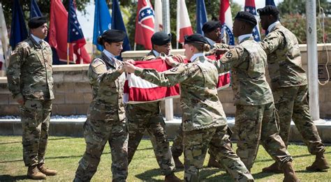 US soldiers folding the American flag