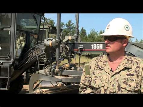 US Navy equipment operators inspecting equipment