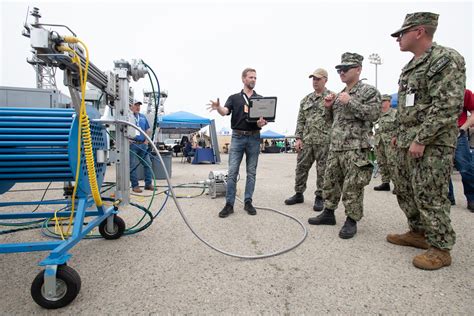 US Navy equipment operators repairing equipment