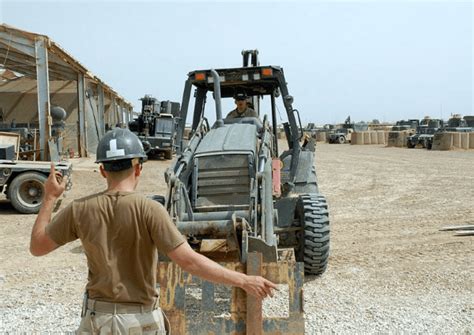 US Navy equipment operators working together