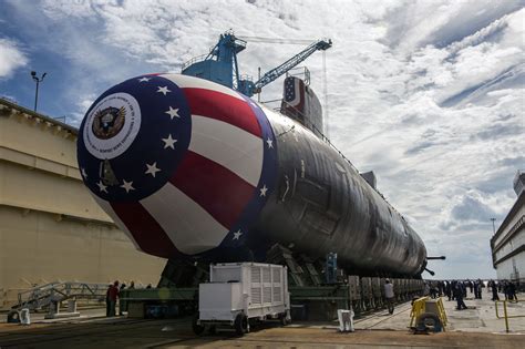 US Navy submarine surfacing in the ocean