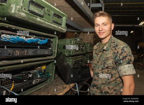 USMC Data System Administrator at a Desk