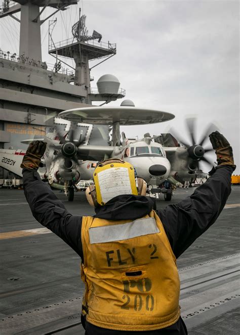 Crew members at work on the USS George H.W. Bush